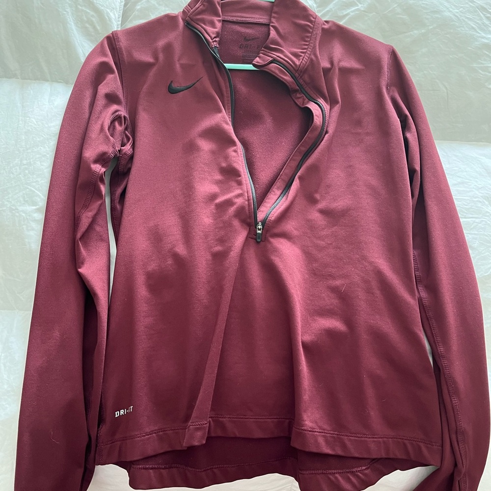 Nike women’s burgundy quarter zip, size medium, gently used